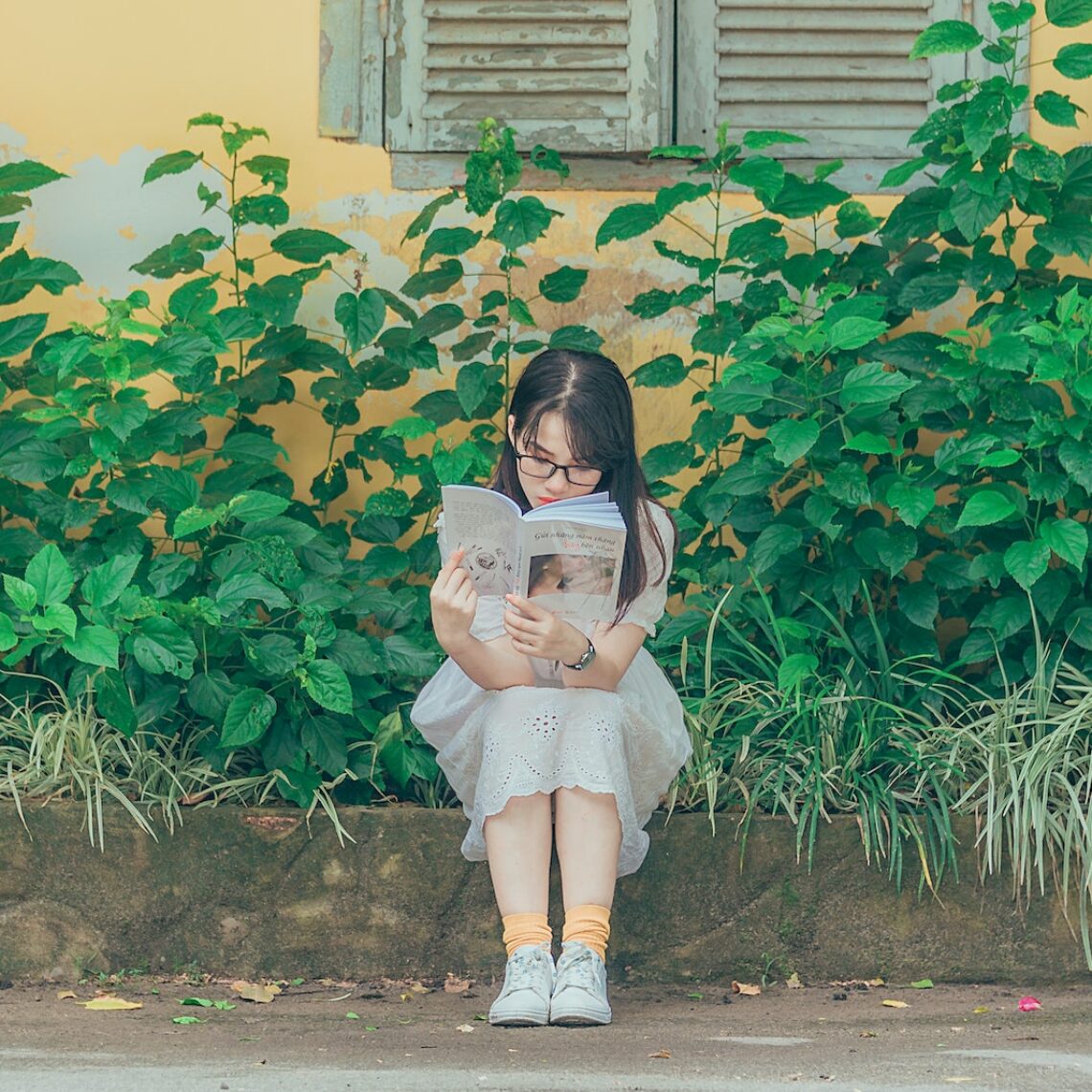 Woman Wearing White Dress Reading Book