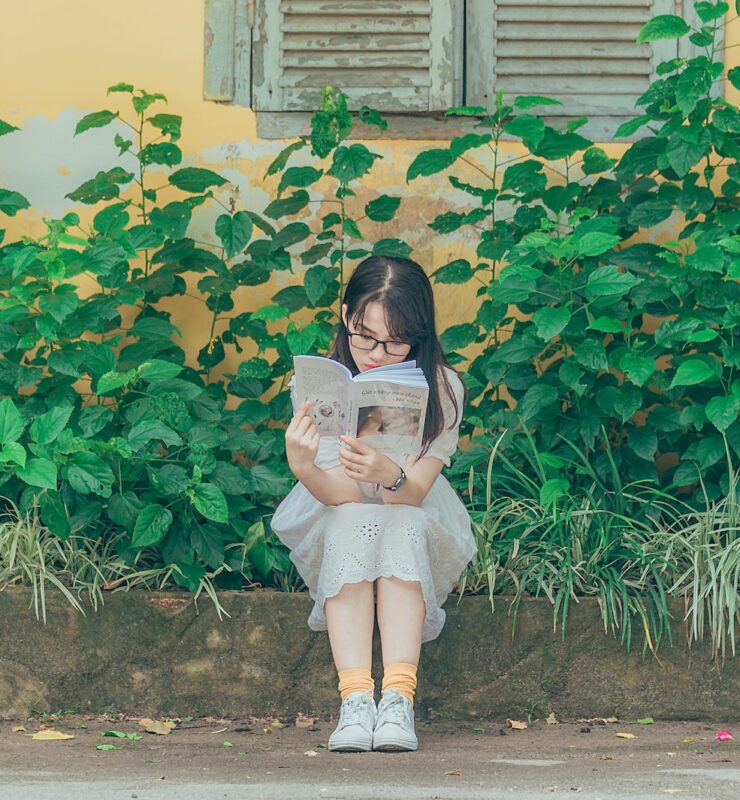 Woman Wearing White Dress Reading Book