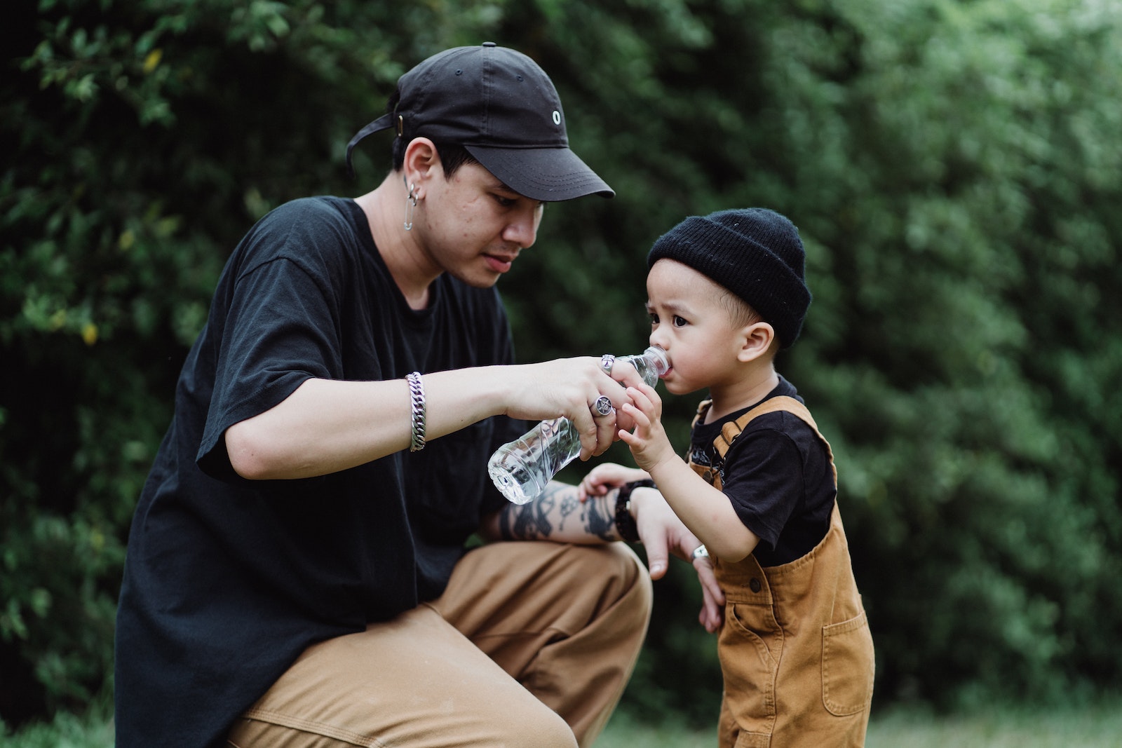 Mother Giving Water to Child